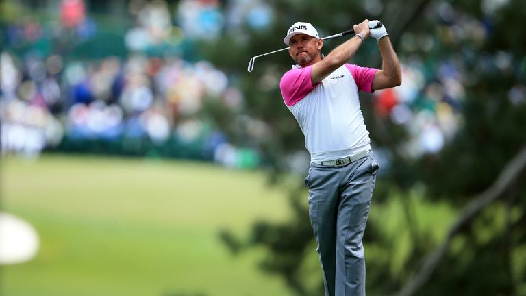 Lee Westwood of England plays his second shot on the first hole during the final round of the 2016 Masters Tournament at Augusta