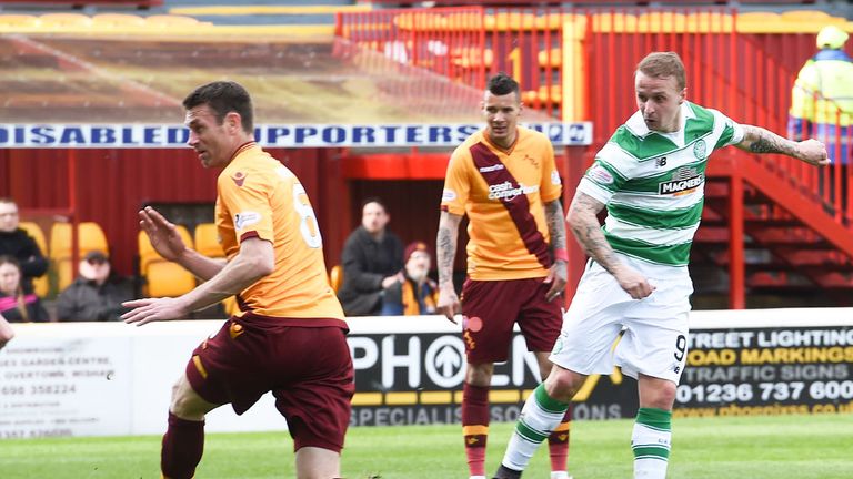 Celtic striker Leigh Griffiths (r) scores the winning goal at Motherwell