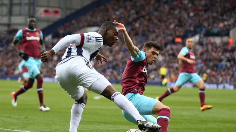  Jonathan Leko of West Bromwich Albion controls the ball under pressure of Aaron Cresswell of West Ham United during the