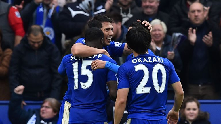 Leicester City's Argentinian striker Leonardo Ulloa (C) celebrates scoring his second and Leicester's third goal 