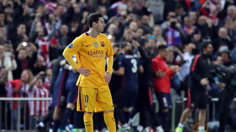 Barcelona's Lionel Messi stands dejecte after Atletico's second goal 