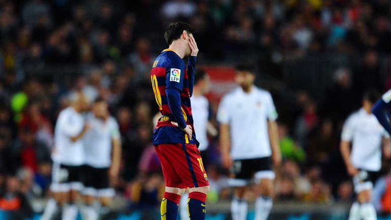 Lionel Messi looks on dejected 