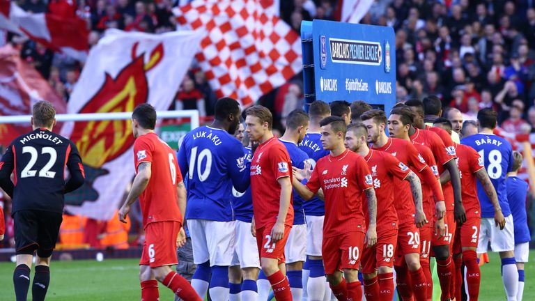 LIVERPOOL, ENGLAND - APRIL 20:  The two sides shake hands prior to the Barclays Premier League match between Liverpool and Everton at Anfield, April 20, 20