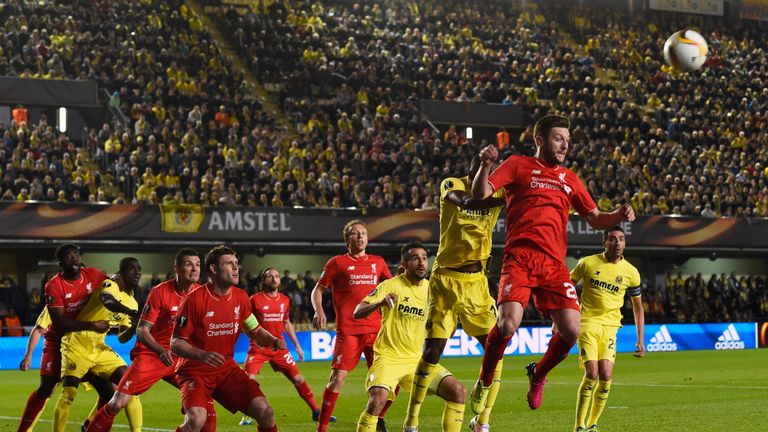 Adam Lallana of Liverpool heads the ball clear during the UEFA Europa League semi final first leg match between Villarreal and Liverpool