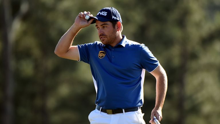 Louis Oosthuizen of South Africa reacts after finishing on the 18th green