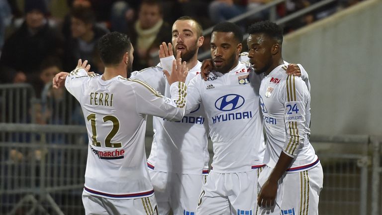 Lyon's French forward Alexandre Lacazette (2nd R) celebrates with his teammates after scoring during the French L1 football match between Lorient and Lyon 