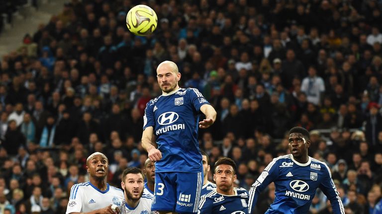 Lyon's French defender Christophe Jallet jumps for a header during match against Marseille at the Velodrome stadium in Marseille, southern France