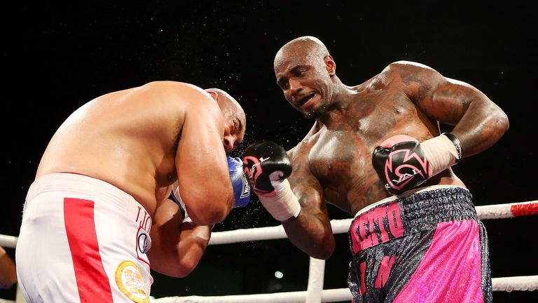 Malik Scott of the USA punches Alex Leapai of Australia during the heavyweight fight at the Logan Metro Sports Centre on