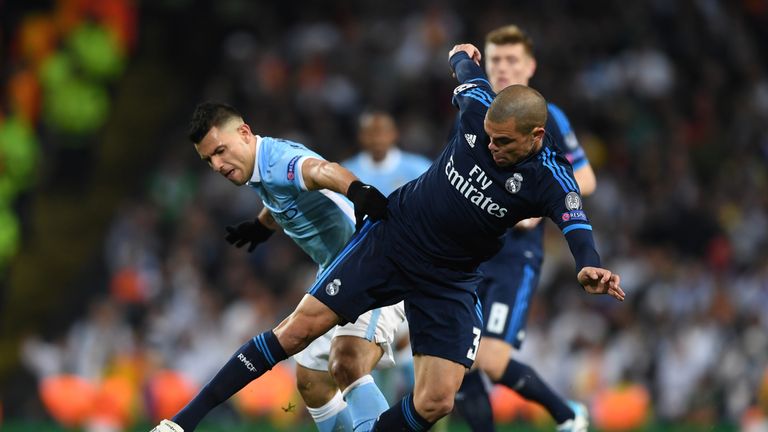 Manchester City's Sergo Aguero is challenged by Real Madrid's Pepe