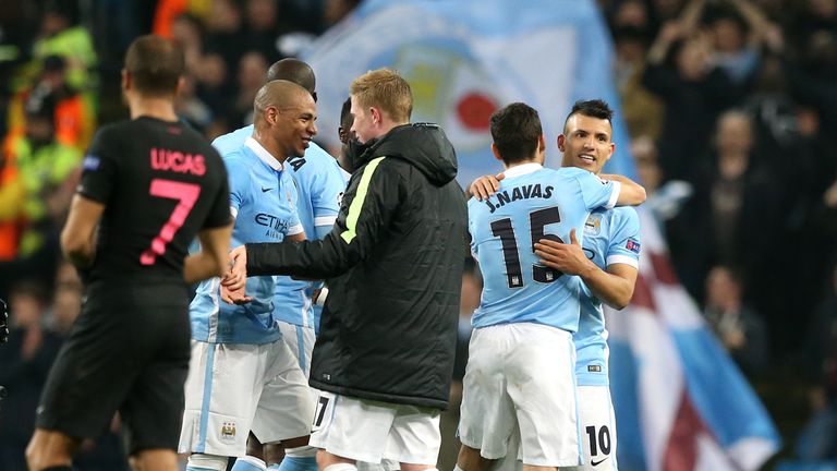 Manchester City's Sergio Aguero (right) celebrates victory with Jesus Navas after beating PSG in the Champions League quarter-finals