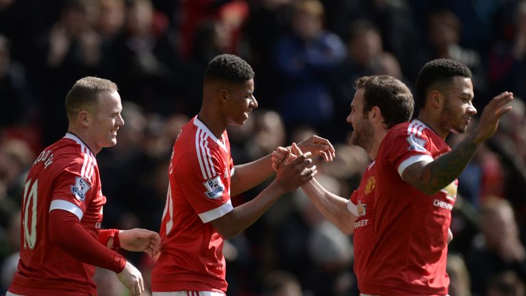 Marcus Rashford celebrates his goal with Juan Mata