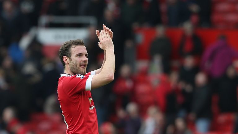 Manchester United midfielder Juan Mata applauds the crowd after the victory over Everton