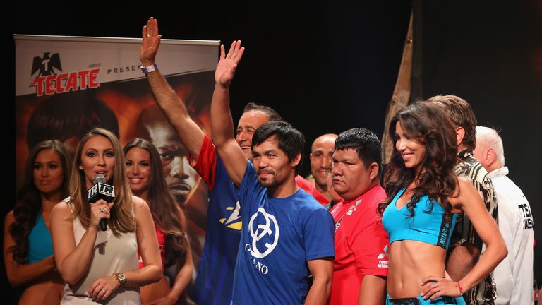 Manny Pacquiao waves to fans following his official weigh-in at MGM Grand Garden Arena 