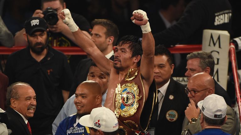  Manny Pacquiao celebrates as he leaves the ring after defeating Timothy Bradley 