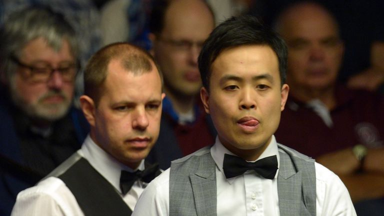 Marco Fu (right) at the table in his match against Barry Hawkins 