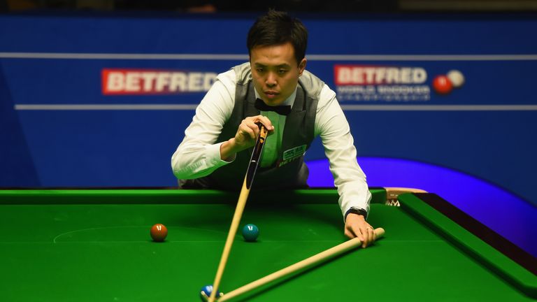 Marco Fu from Hong Kong in action during his quarter final match against Barry Hawkins of England on day eleven of the World Championships