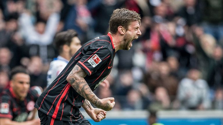 Marco Russ celebrates Eintracht Frankfurt's opening goal against Mainz
