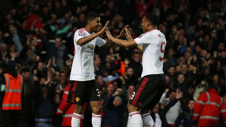 LONDON, ENGLAND - APRIL 13:  Marcus Rashford of Manchester United celebrates scoring the opening goal with Anthony Martial of Manchester United during The 