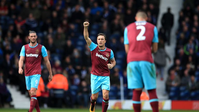West Ham United's Mark Noble (centre) celebrates scoring his sides second goal of the game