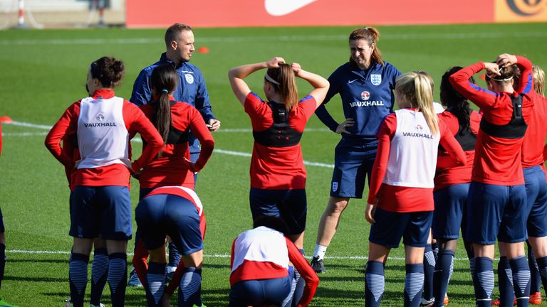 England head coach Mark Sampson talks to his squad