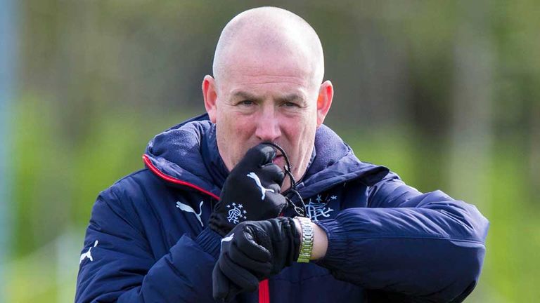 Mark Warburton blowing whistle and looking at watch