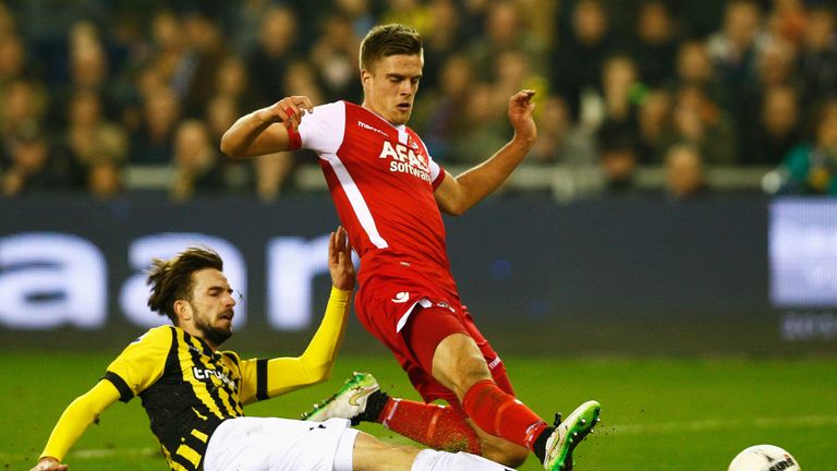 Davy Propper  (L) of Vitesse chases, tackles and stops Markus Henriksen of AZ shooting on goal during the Dutch Eredivisie