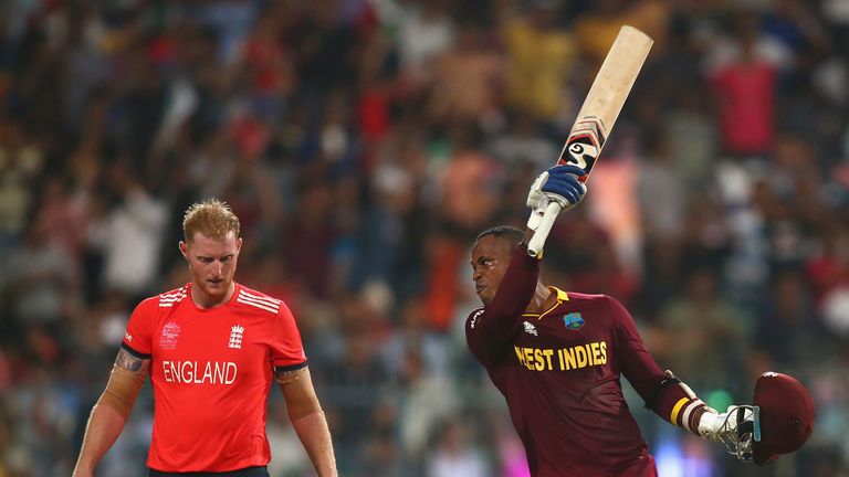 Marlon Samuels of the West Indies celebrates and looks towards England's Ben Stokes