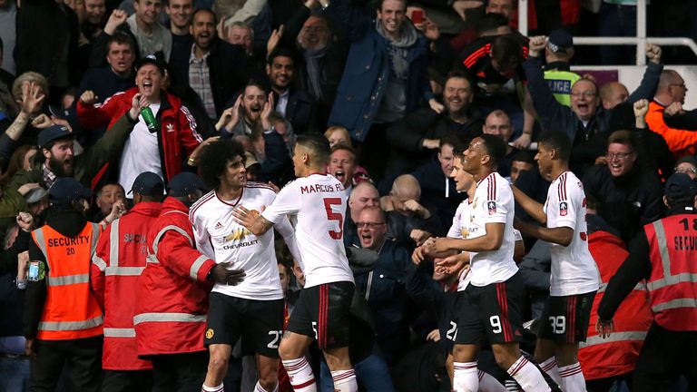Manchester United's Marouane Fellaini (left) celebrates scoring their second goal 