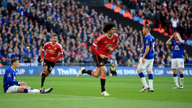 Manchester United's Marouane Fellaini (centre) celebrates scoring his side's first goal of the game during the Emirates FA Cup, Semi-Final match at Wembley