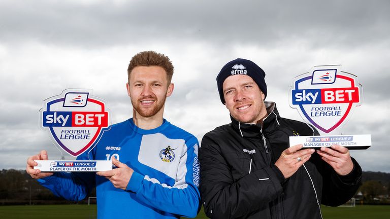 Bristol Rovers duo Matty Taylor (left) and Darrell Clarke with their monthly awards for March