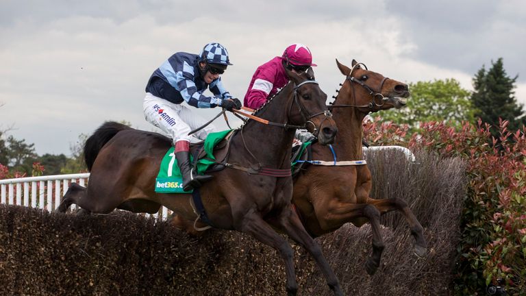 Menorah ridden by Richard Johnson (left) clears the last fence before in company with Valseur Lido ridden by Bryan Cooper before going on to win The bet365