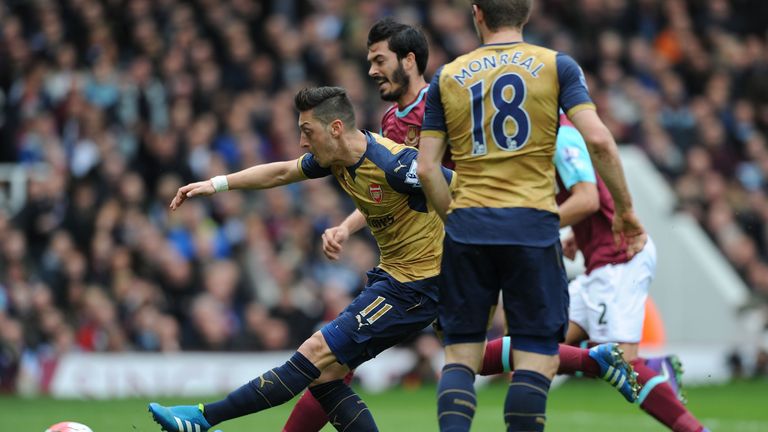 Mesut Ozil opens the scoring for Arsenal at West Ham