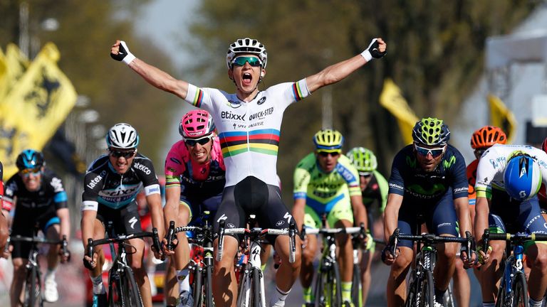 Michal Kwiatkowski celebrates as he crosses the finish line and win the 50th edition of the Amstel Gold race on April 