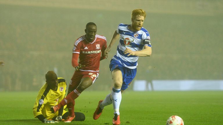 Paul McShane of Reading gets past Albert Adomah of Middlesbroug.