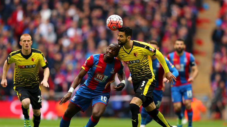 Miguel Angel Britos of Watford and Yannick Bolasie of Crystal Palace battle for the ball during the FA Cup semi-final at Wembley