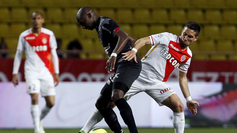 Monaco's Portuguese midfielder  Joao Moutinho (R) vies for the ball  with Guincamp's French midfielder Younousse Sankhare 
