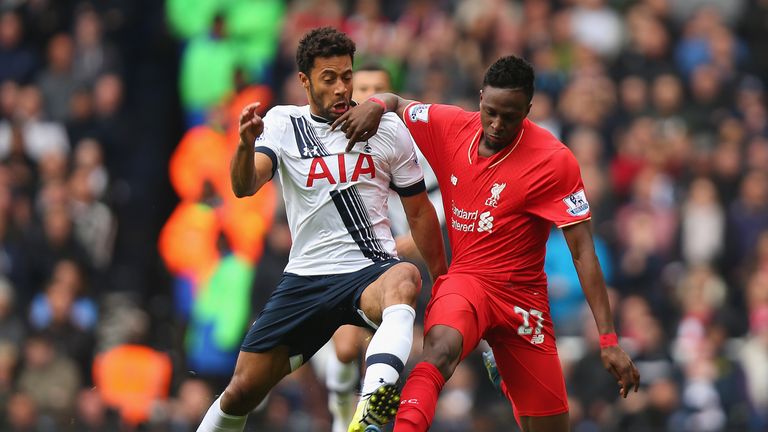 Divock Origi of Liverpool and Mousa Dembele of Tottenham Hotspur compete for the ball during the Premier League match at White Hart Lane