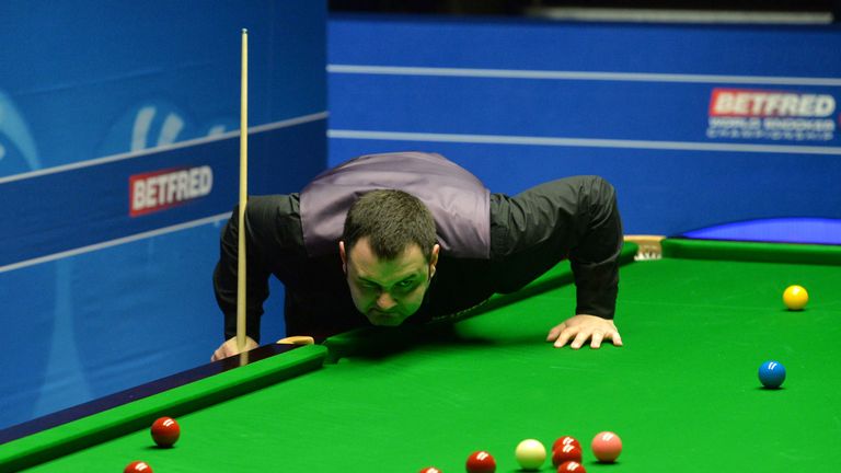 Stephen Maguire studies the table in his match against Alan McManus