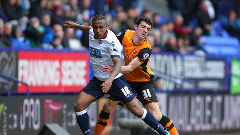 Neil Danns of Bolton Wanderers controls the ball under pressure of Brian Lenihan of Hull City during the Sky Bet Championship clash at the Macron Stadium