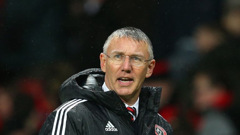 MANCHESTER, ENGLAND - JANUARY 09: Nigel Adkins, the manager of Sheffield United walks in at half time