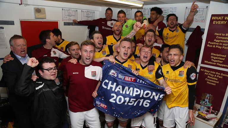 Northampton Town players celebrate after being crowned Champions of League Two
