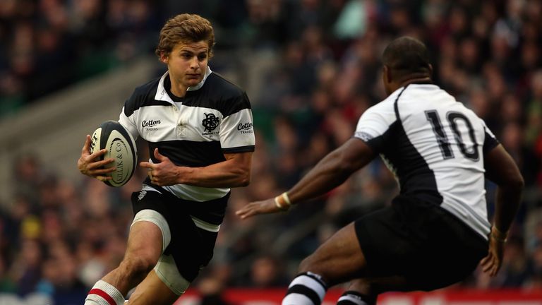 Patrick Lambie of the Barbarians takes on the Fiji defence during the Killik Cup match between the Barbarians and Fiji