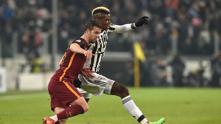 Paul Pogba (R) of Juventus competes with Miralem Pjanic of Roma 