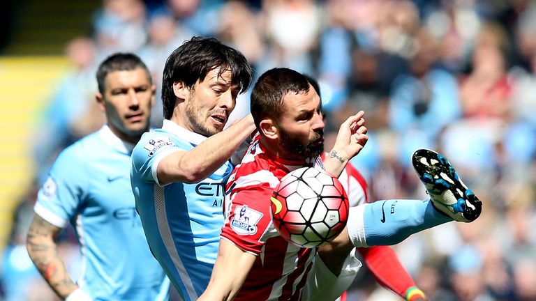 Stoke City's Phil Bardsley and Manchester City's David Silva(left) during the Barclays Premier League match at the Etihad Stadium, Manchester. PRESS ASSOCI