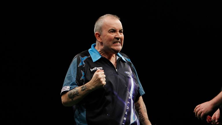 Phil Taylor celebrates victory over James Wade that took him clear of the chasing Premier League pack (Pic: Lawrence Lustig)