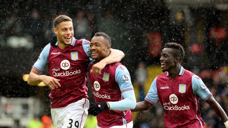 Jordan Ayew (centre) of Aston Villa celebrates scoring his team's second goal with his team-mates Rudy Gestede (left) and Idrissa Gue
