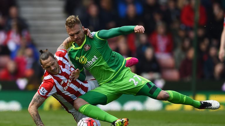 Marko Arnautovic of Stoke and Jan Kirchhoff of Sunderland compete for the ball