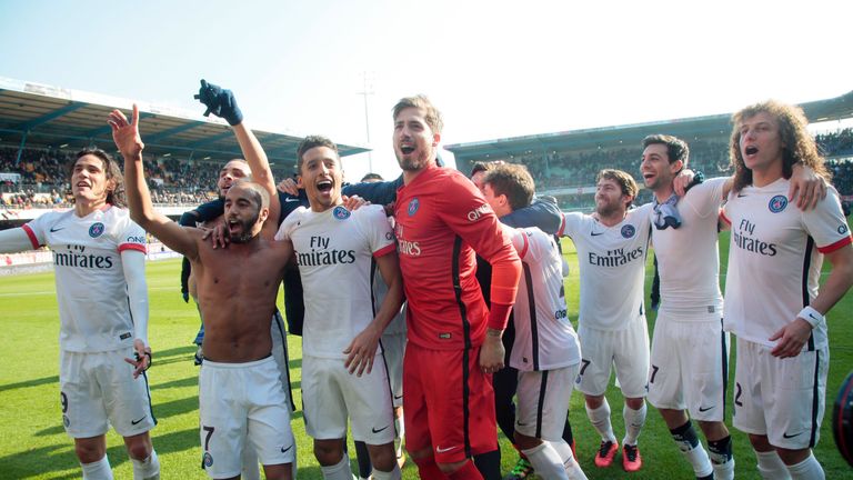 Paris Saint-Germain players celebrate after winning the Ligue 1 title at Troyes