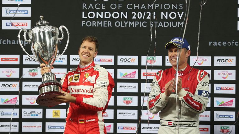 LONDON, ENGLAND - NOVEMBER 21:  Winner Sebastian Vettel of Germany is applauded by runner up Tom Kristensen of Denmark after winning the Race of Champions 