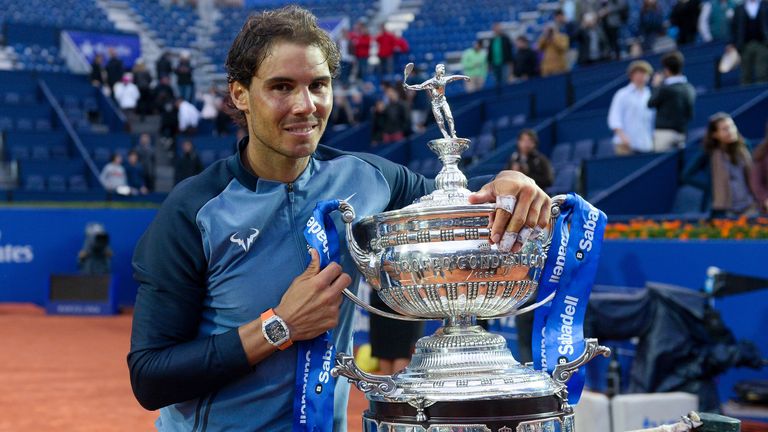 Rafael Nadal poses with his trophy after beating Kei Nishikori to win the Barcelona Open